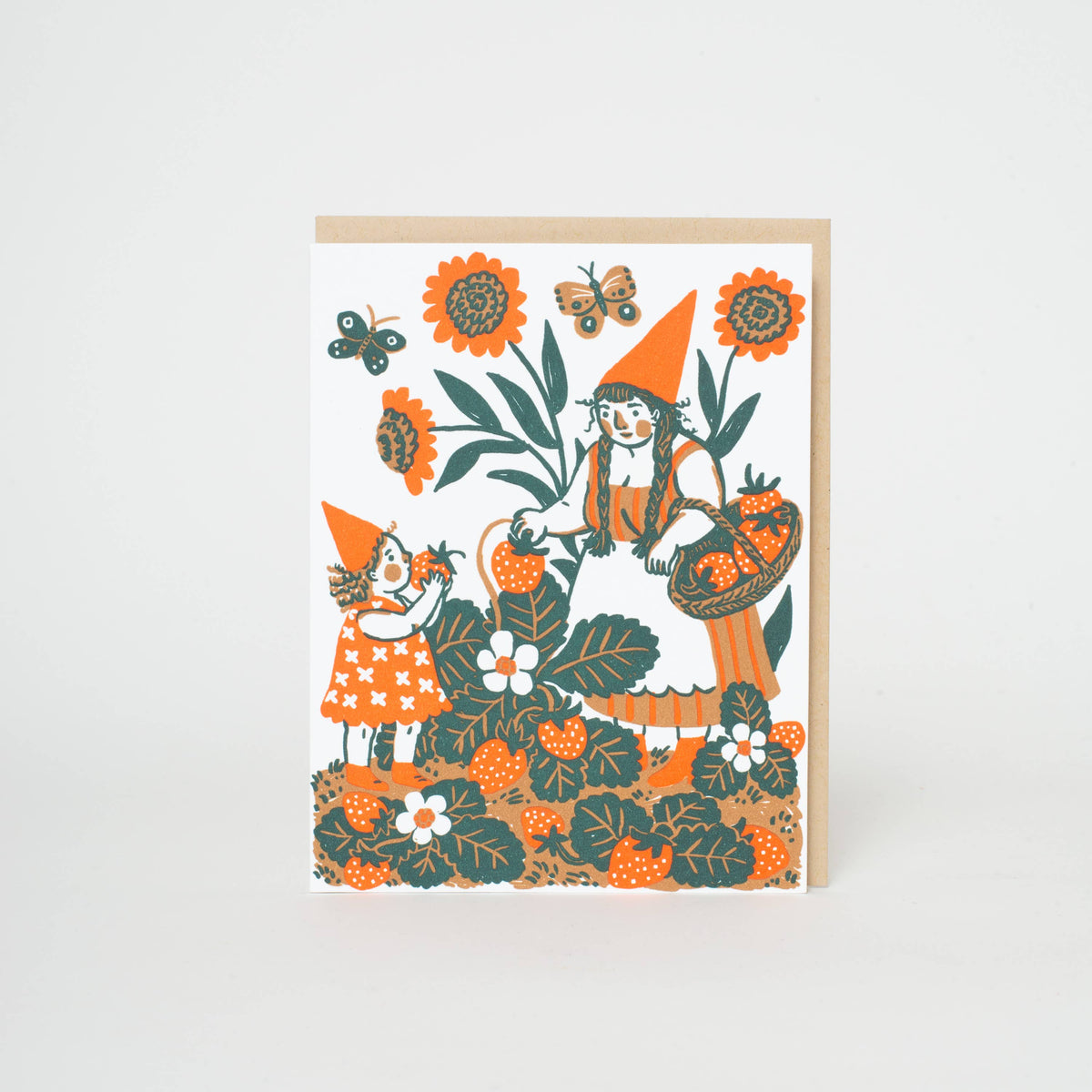 An everyday greeting card featuring a sweet illustration of a gnome and kiddo picking strawberries. Letterpress printed and packaged with a kraft paper envelope. 