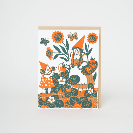 An everyday greeting card featuring a sweet illustration of a gnome and kiddo picking strawberries. Letterpress printed and packaged with a kraft paper envelope. 