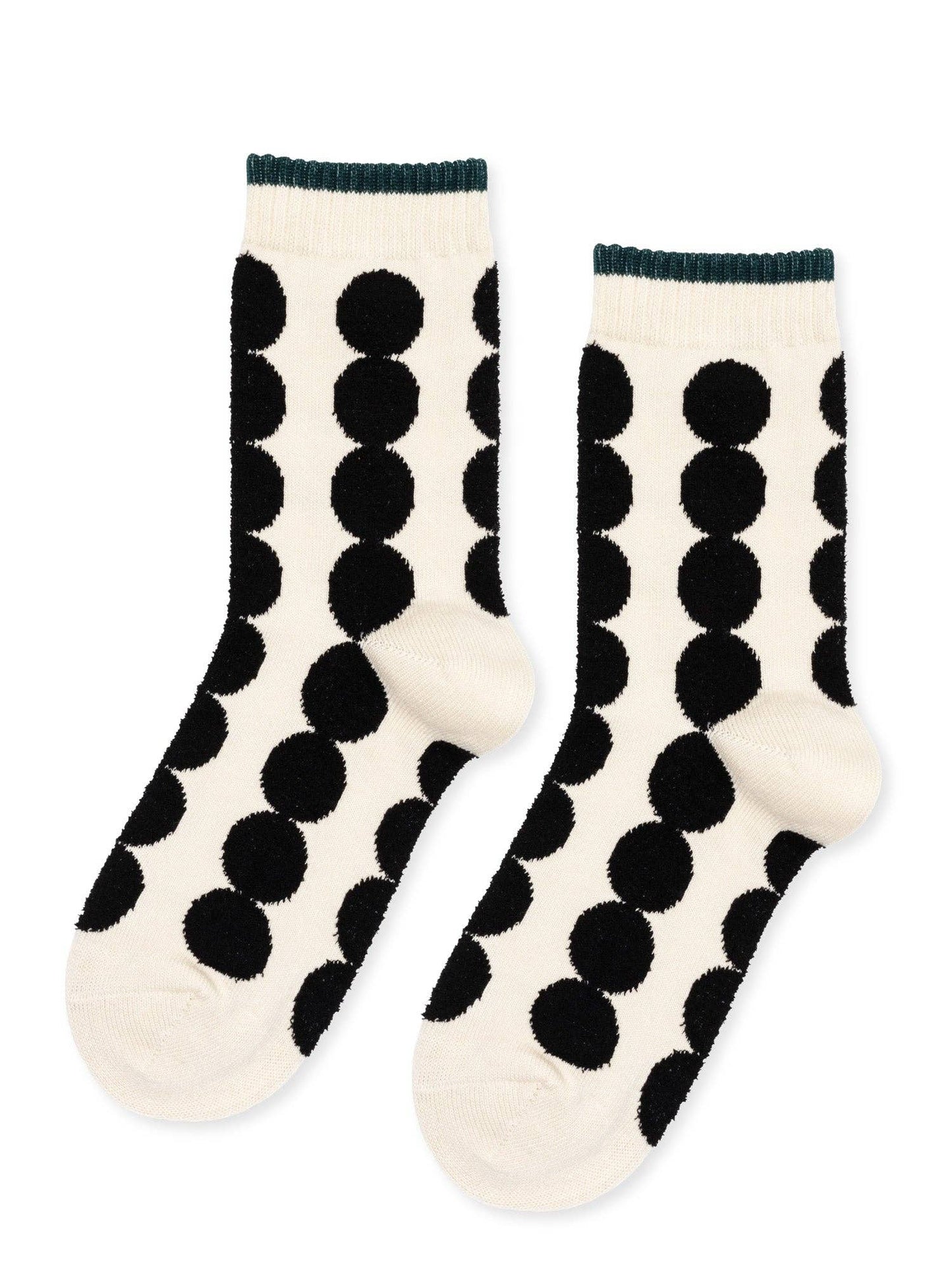 Pair of white socks with black polka dot pattern on a white background