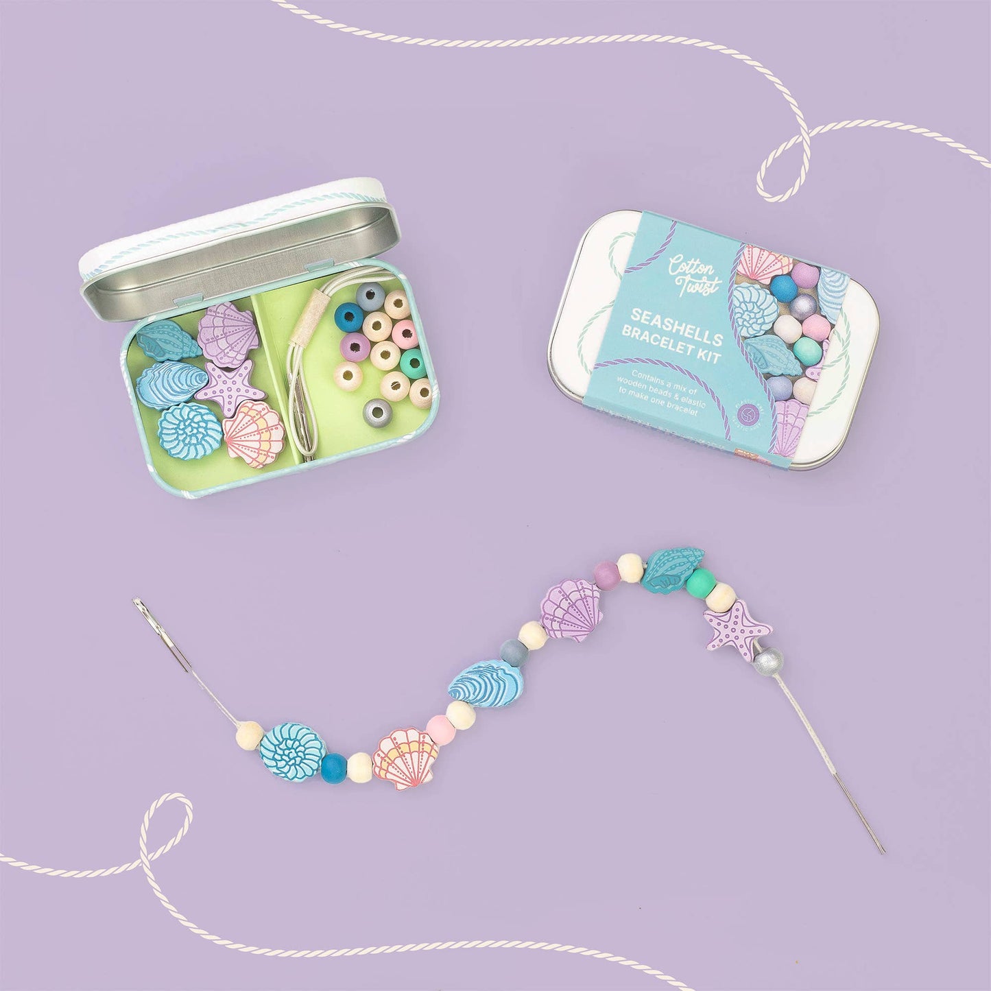 Seashell bracelet kit with open tin and completed bracelet on a purple background
