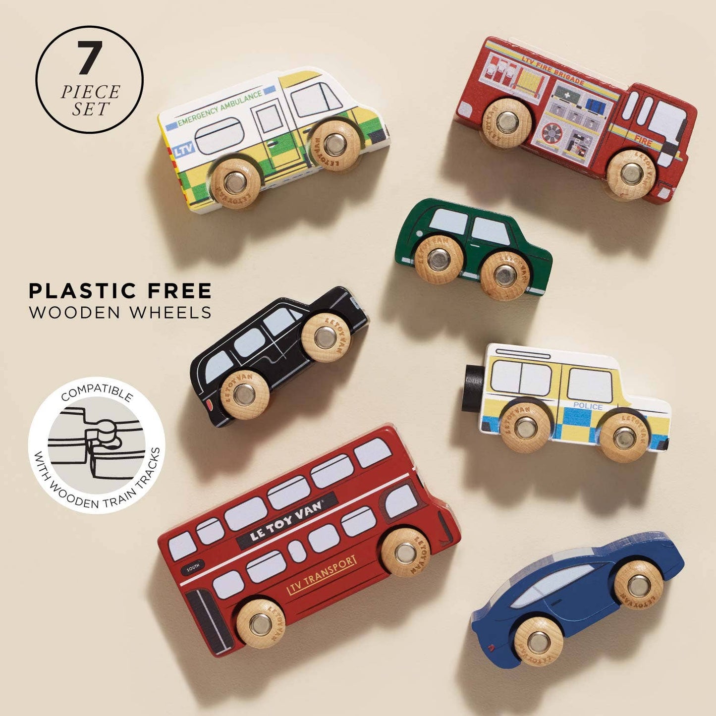 Set of plastic-free wooden toy vehicles on a beige background