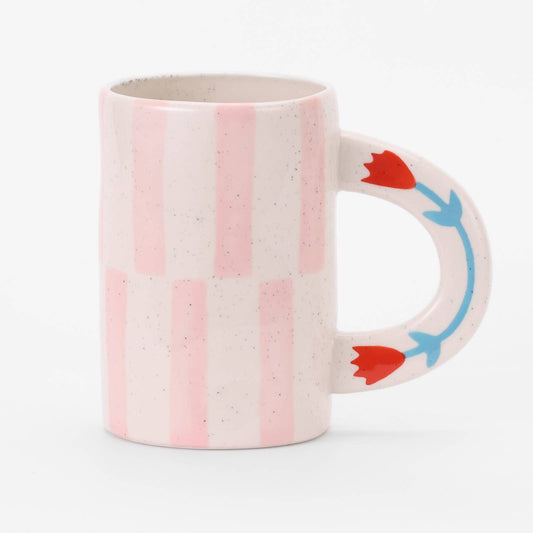 Mug with pink stripes and red and blue floral handle on a white background