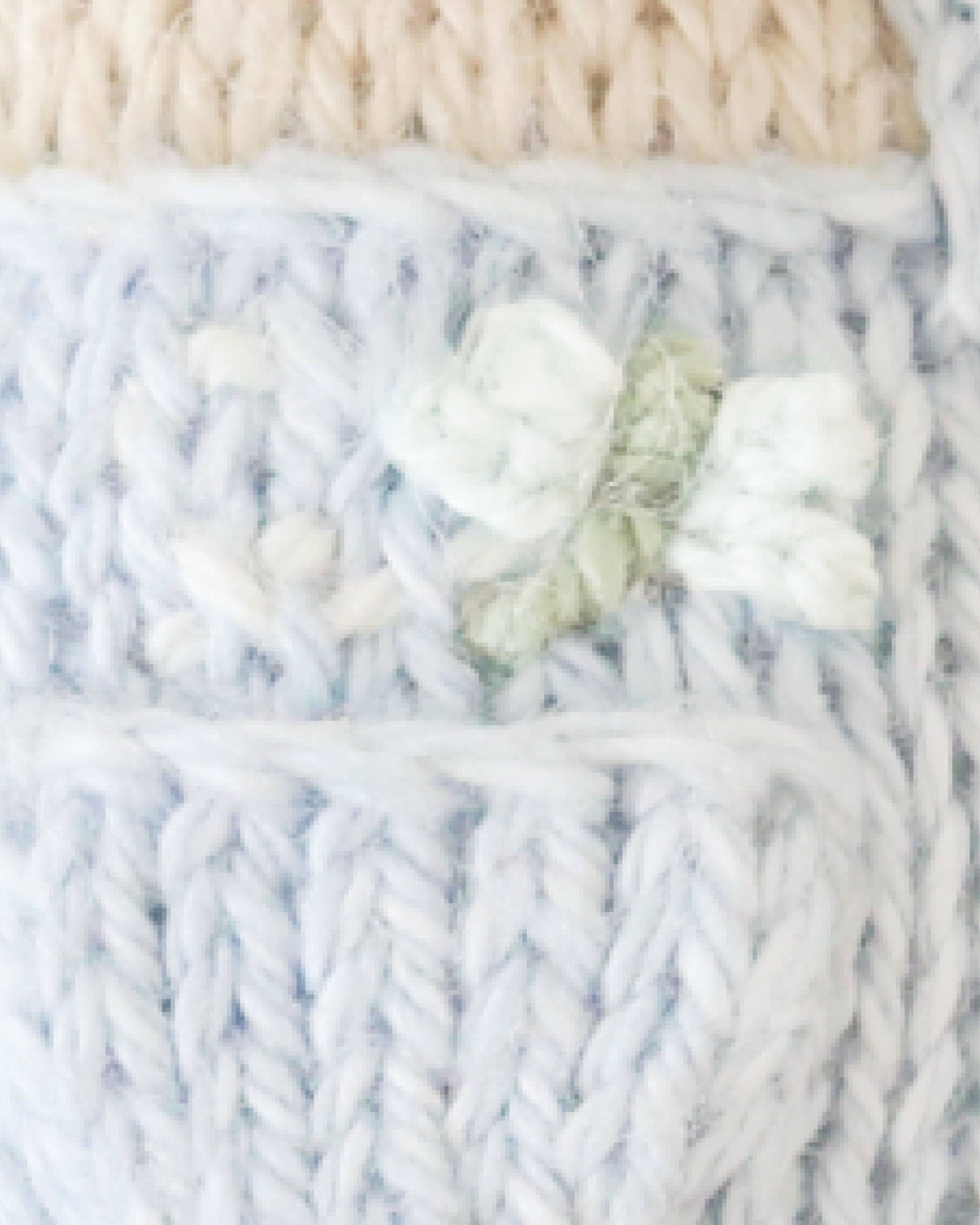 Close-up of knitted fabric with a dragonfly
