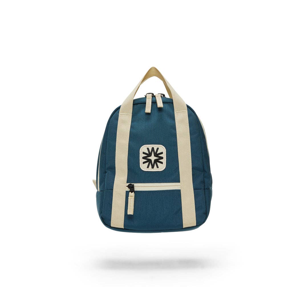 Navy kids backpack with ivory straps and a black and white embroidered design on a patch on the front, on a white background