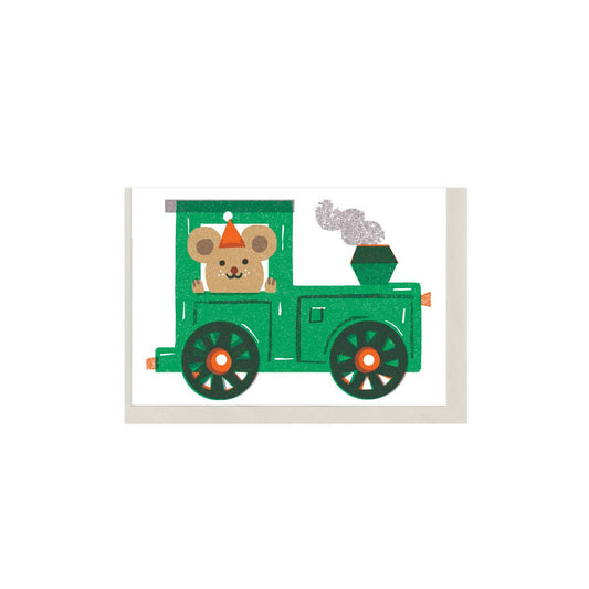 Toy train with a teddy bear driver on a white background