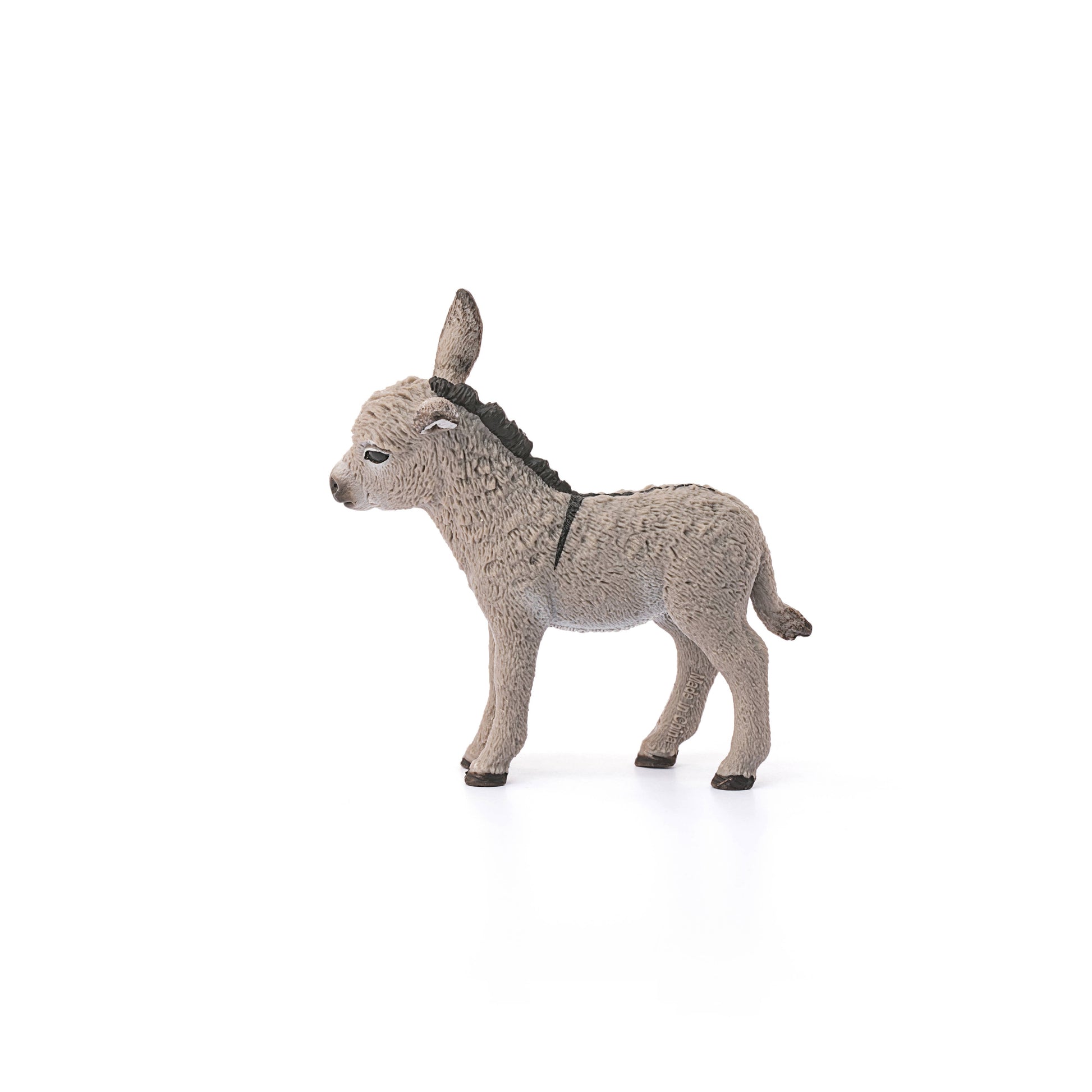 side view of donkey figuring on white background
