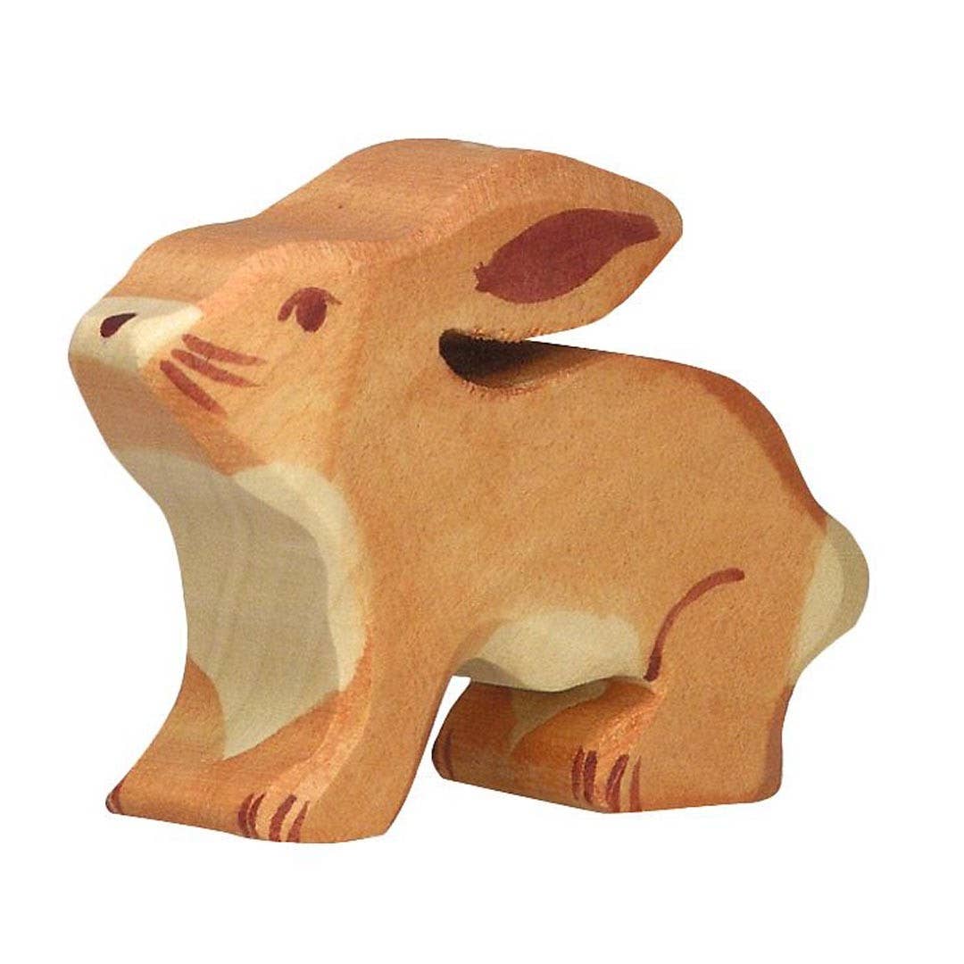 Wooden rabbit figurine on a white background