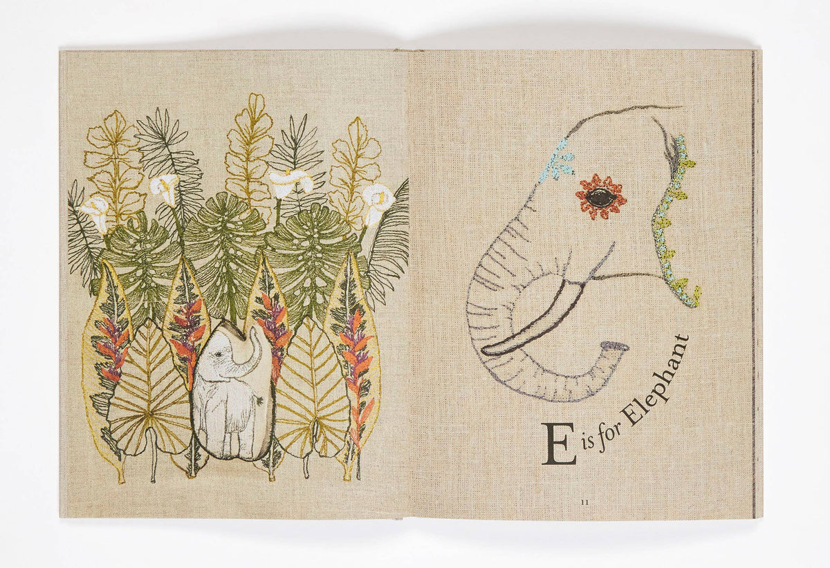 Illustration book page with 'E is for Elephant' on a textured beige background