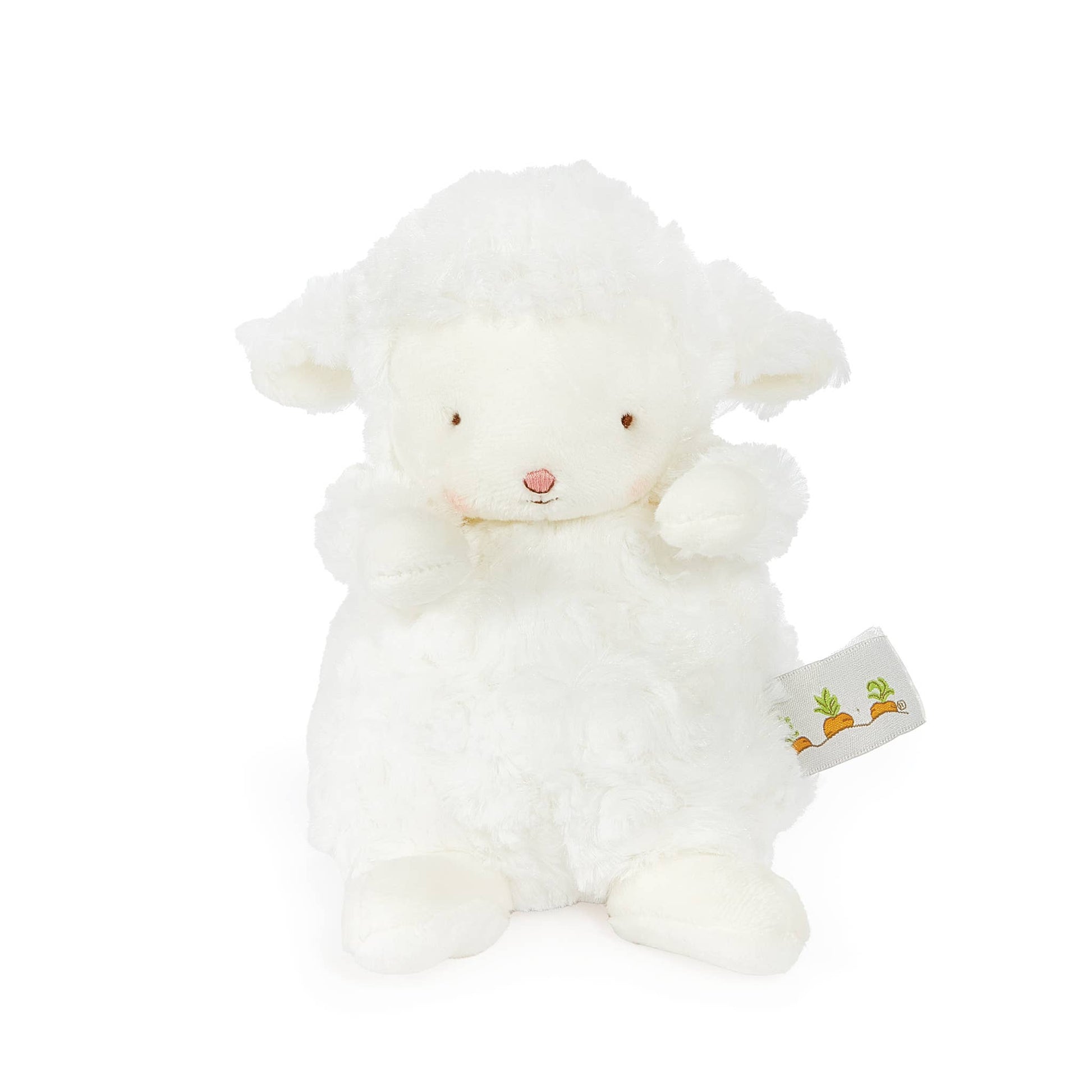 White plush lamb toy with a visible tag on a white background