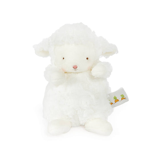 White plush lamb toy with a visible tag on a white background