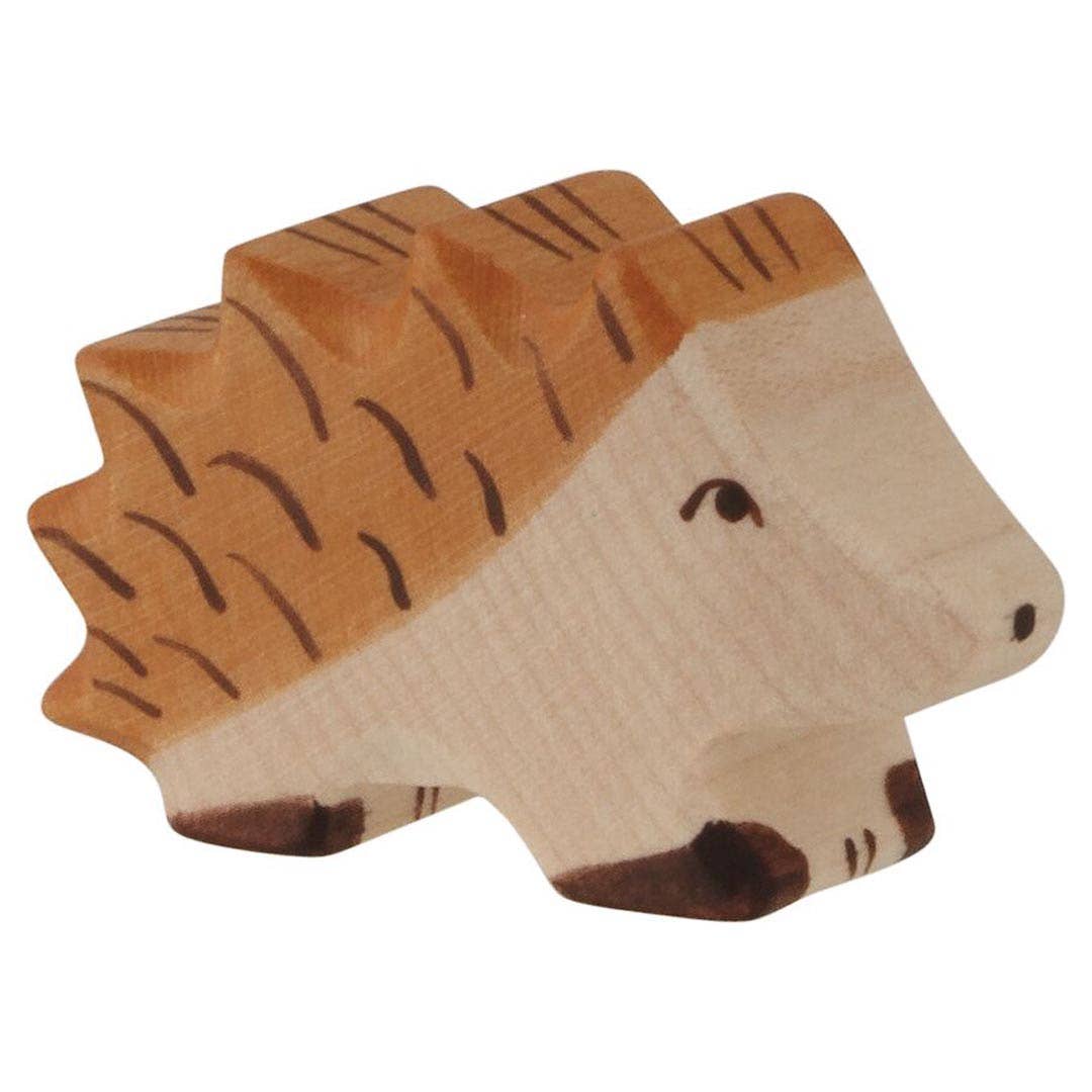 Wooden toy hedgehog on a white background