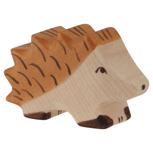 Wooden toy hedgehog on a white background