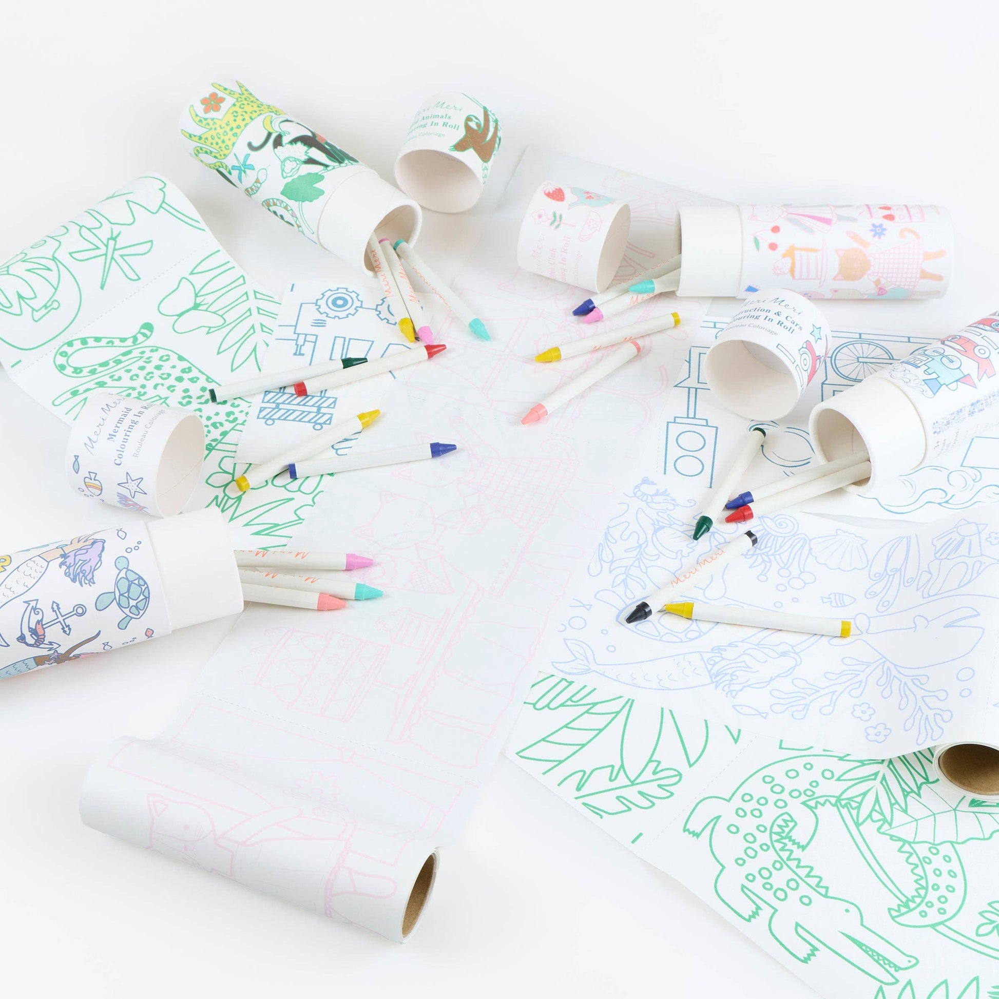 Coloring activity with paper tube and crayons on a white surface