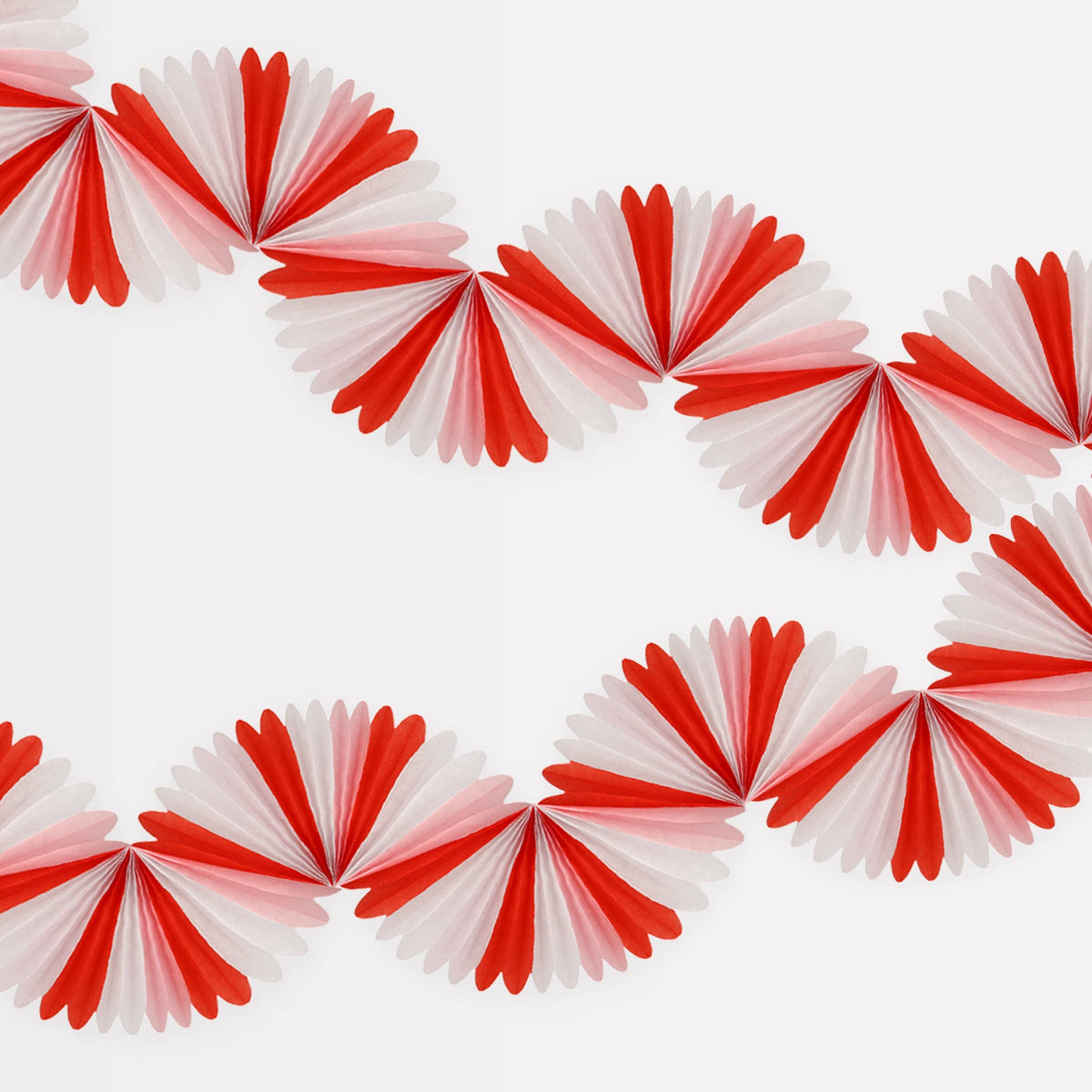 Red and white paper fan decorations arranged in a circular pattern on a white background