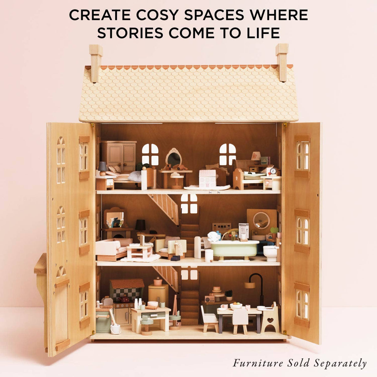 Wooden dollhouse with open doors on a pink background, featuring text about creating cozy spaces for stories.