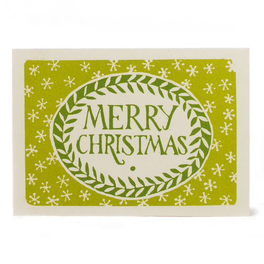 Sap and green Merry Christmas greeting card with a leafy oval wreath and small star motifs.