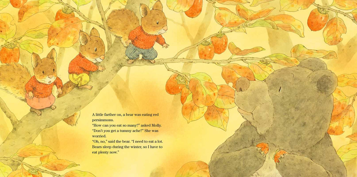 A children's book illustration showing several small foxes in orange sweaters among orange leaves and hanging oranges, with a large bear on the right and a short text block in the lower left.