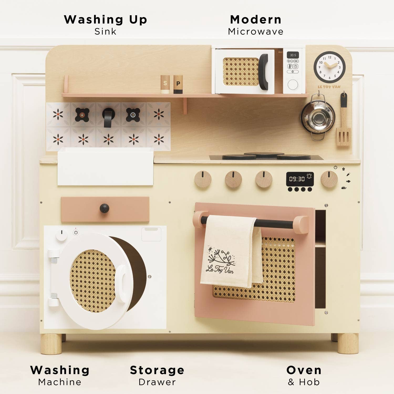 Wooden play kitchen set with various appliances on a white background