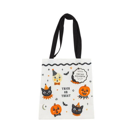 Halloween-themed tote bag with black handles on a white background
