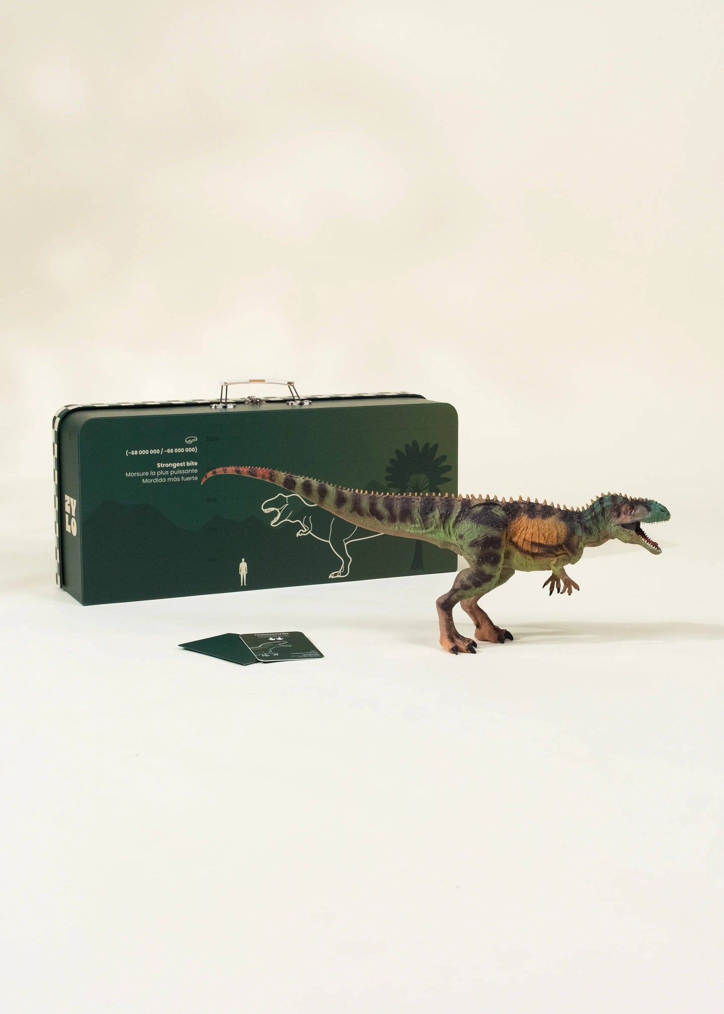 Dinosaur model with a carrying case on a white background
