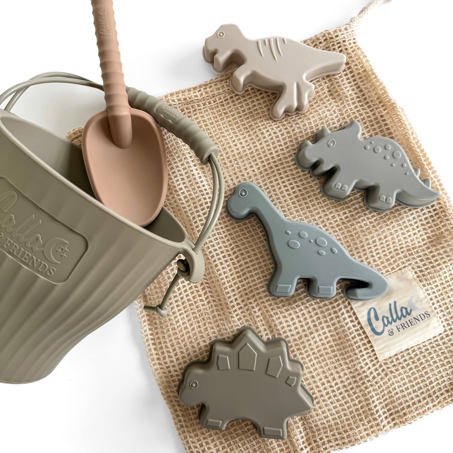 Children's sand playset with dinosaur-shaped tools on a mesh bag, featuring the brand 'Calla & Friends'.