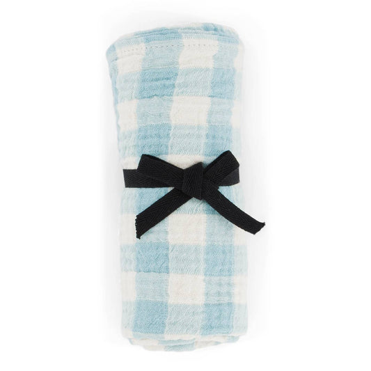 Plaid blanket with a black bow on a white background