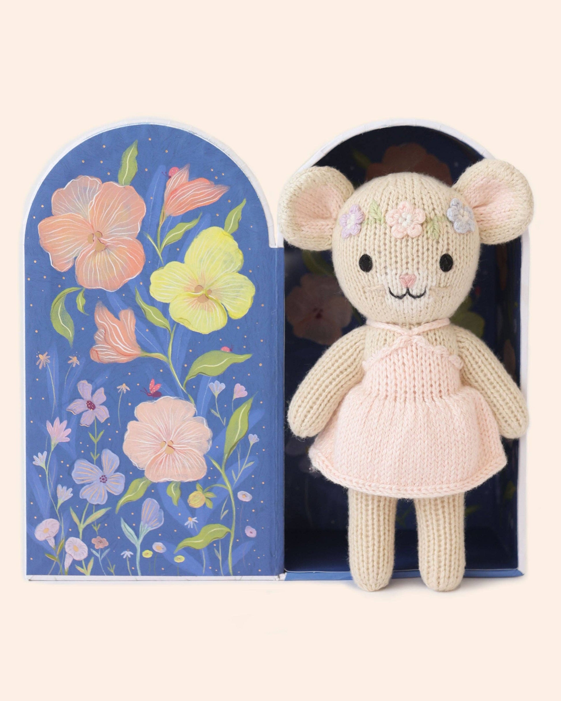 Knitted mouse toy in a decorative box with floral design