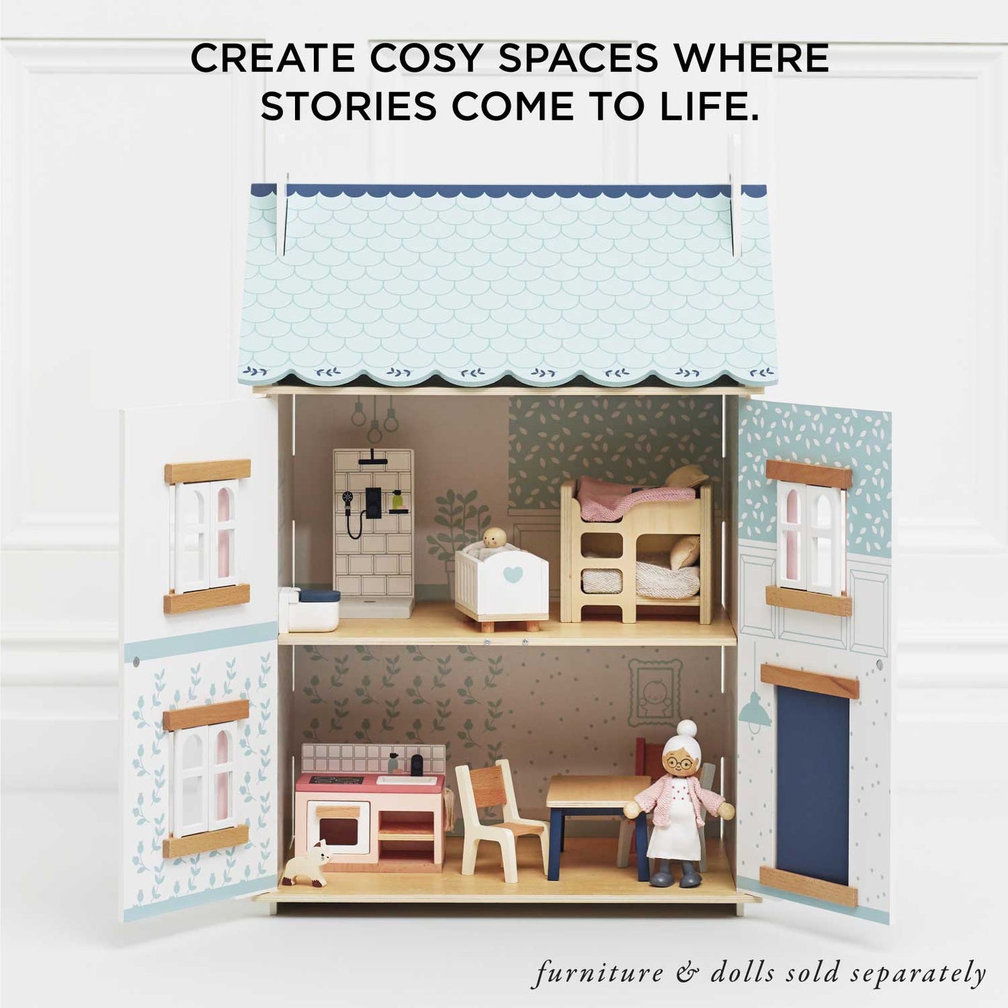 Toy dollhouse with furniture and dolls, text 'Create cosiy spaces where stories come to life.'