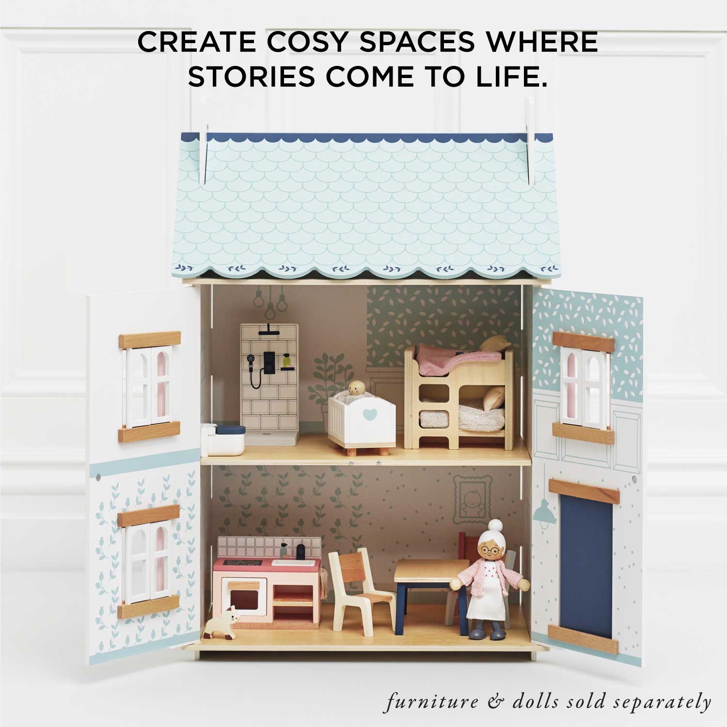 Toy dollhouse with furniture and dolls, text 'Create cosiy spaces where stories come to life.'