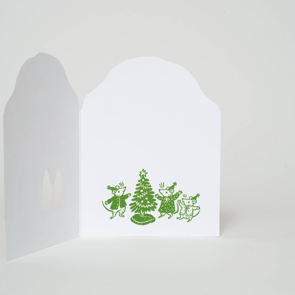 Interior of card featuring three mice near a christmas tree in green print
