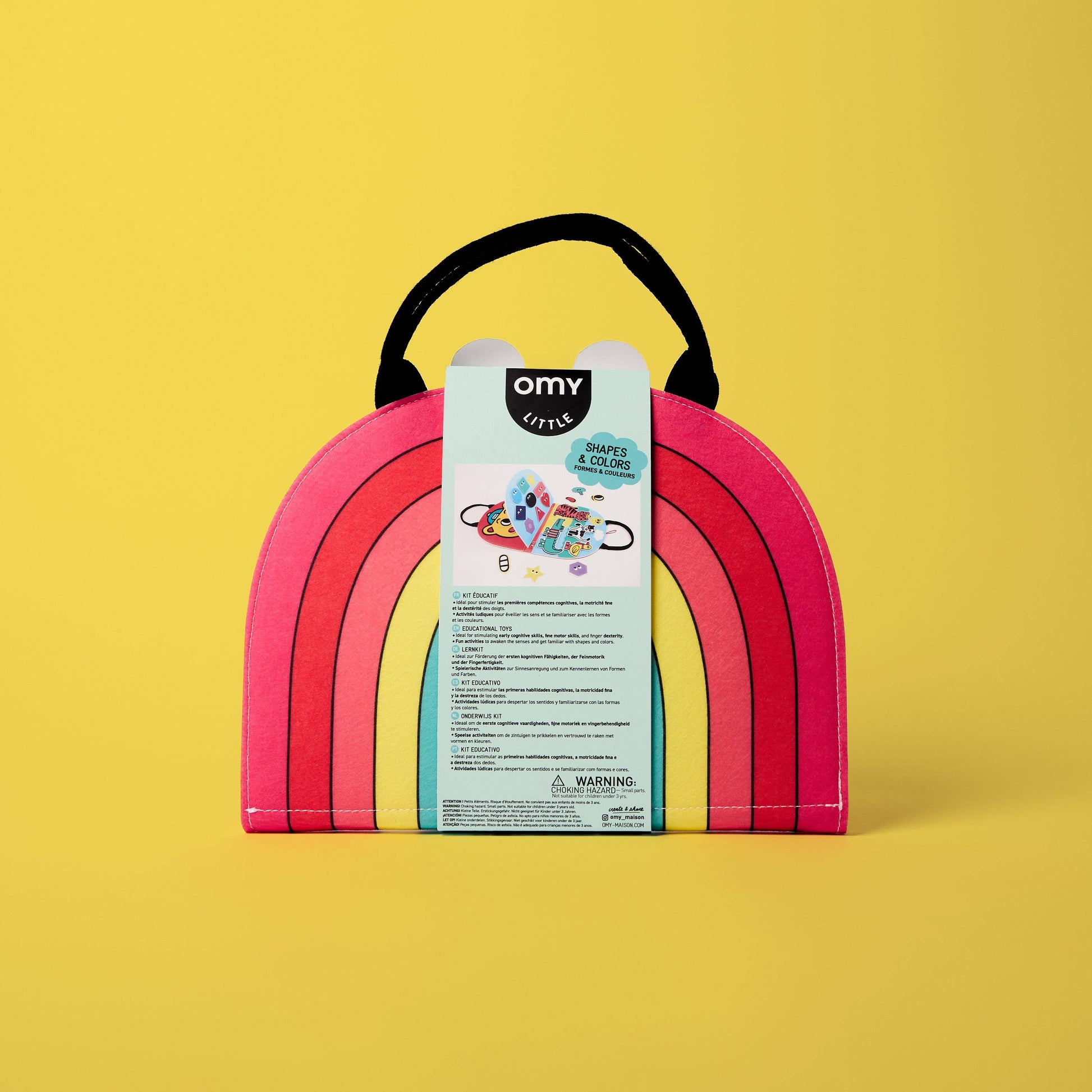 Rainbow-shaped toy box with a label on a yellow background