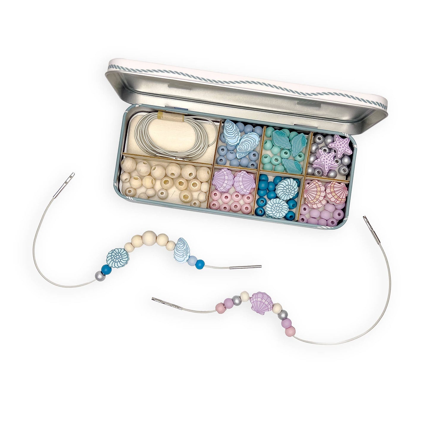 Bead crafting kit with colorful beads and tools on a white background