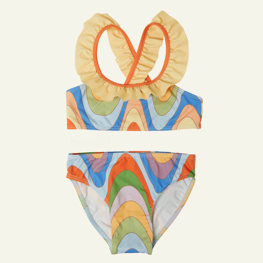 Colorful retro groovy bikini set with ruffled top on a white background