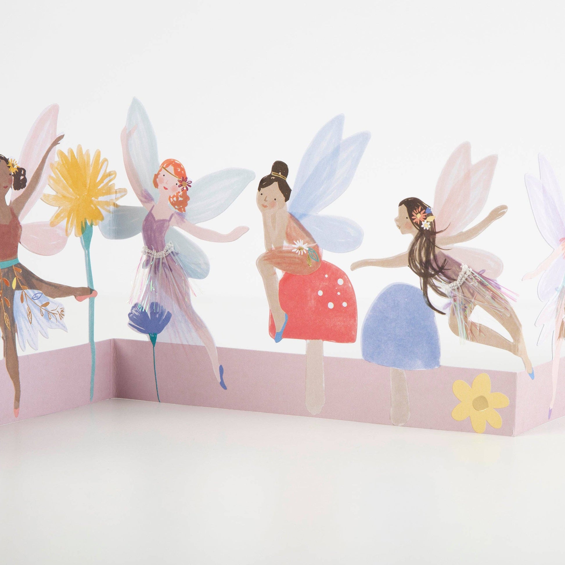 Wall decal with fairy designs on a white wall