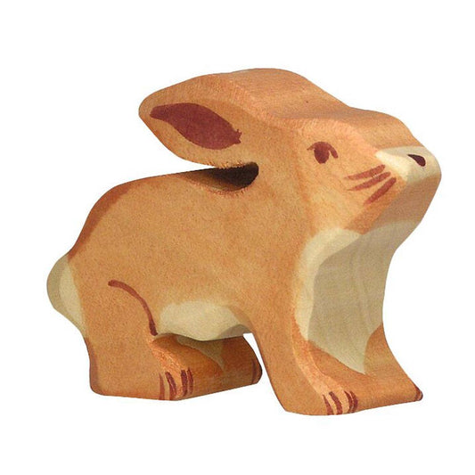 Wooden toy dog figure on a white background