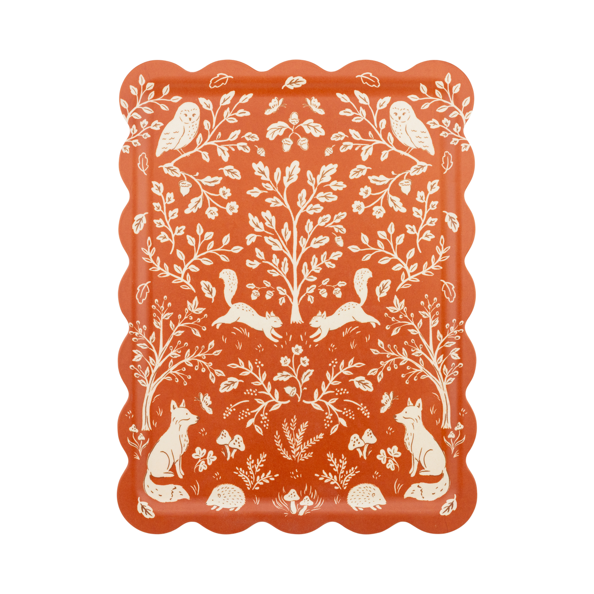 Decorative plate with white animal and nature pattern on a red background