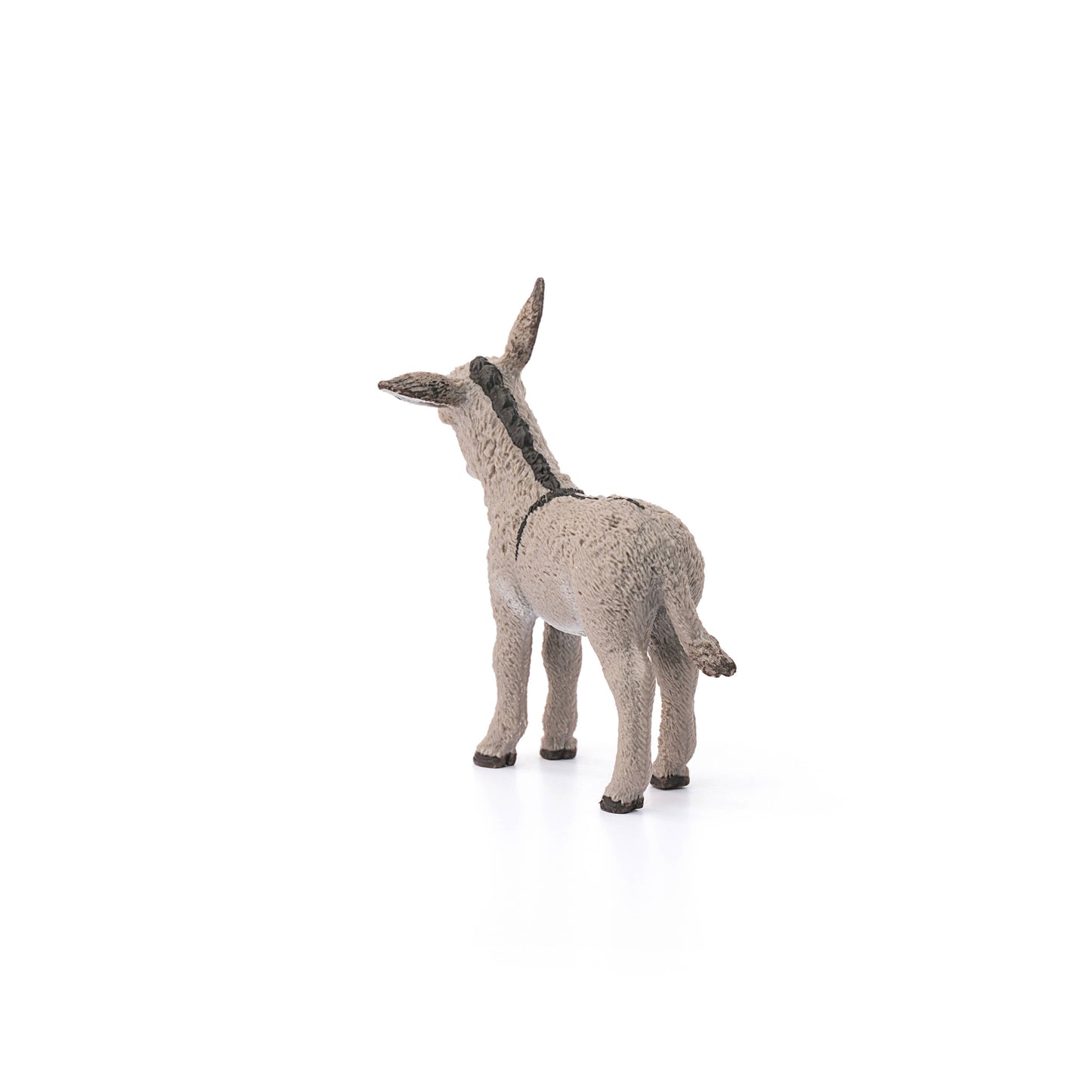 back view of donkey figurine on white background