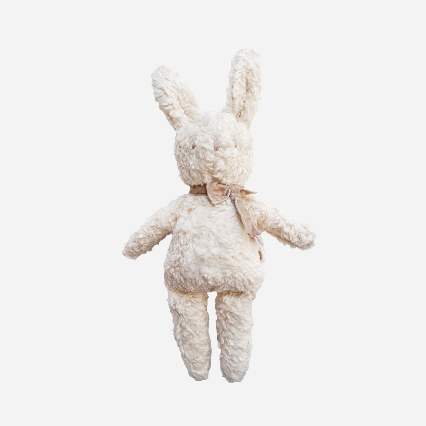 White plush bunny toy on a light gray background