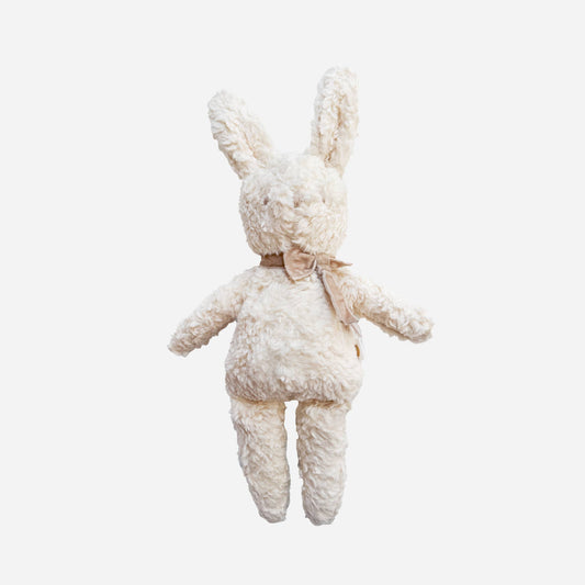 White plush bunny toy on a light gray background
