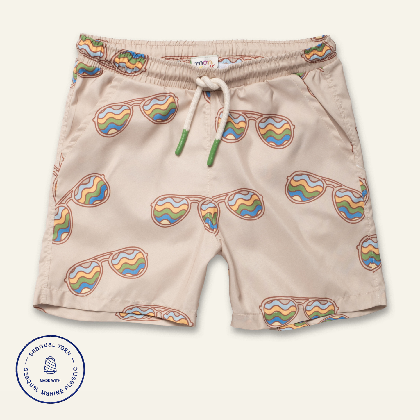 Beige shorts with rainbow sunglasses pattern on a white background