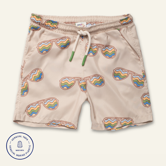 Beige shorts with rainbow sunglasses pattern on a white background