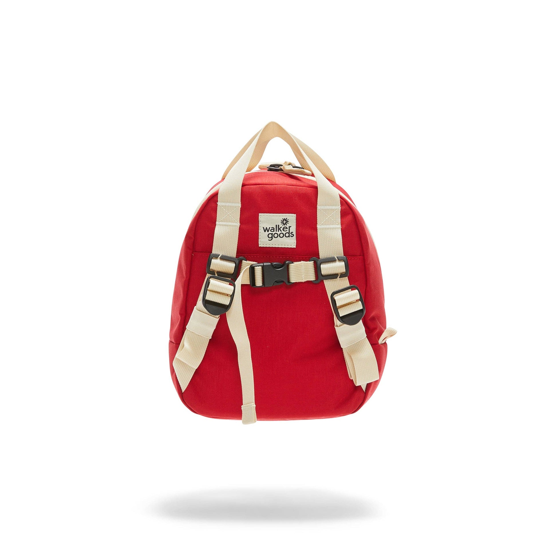 back of red kids backpack with ivory straps