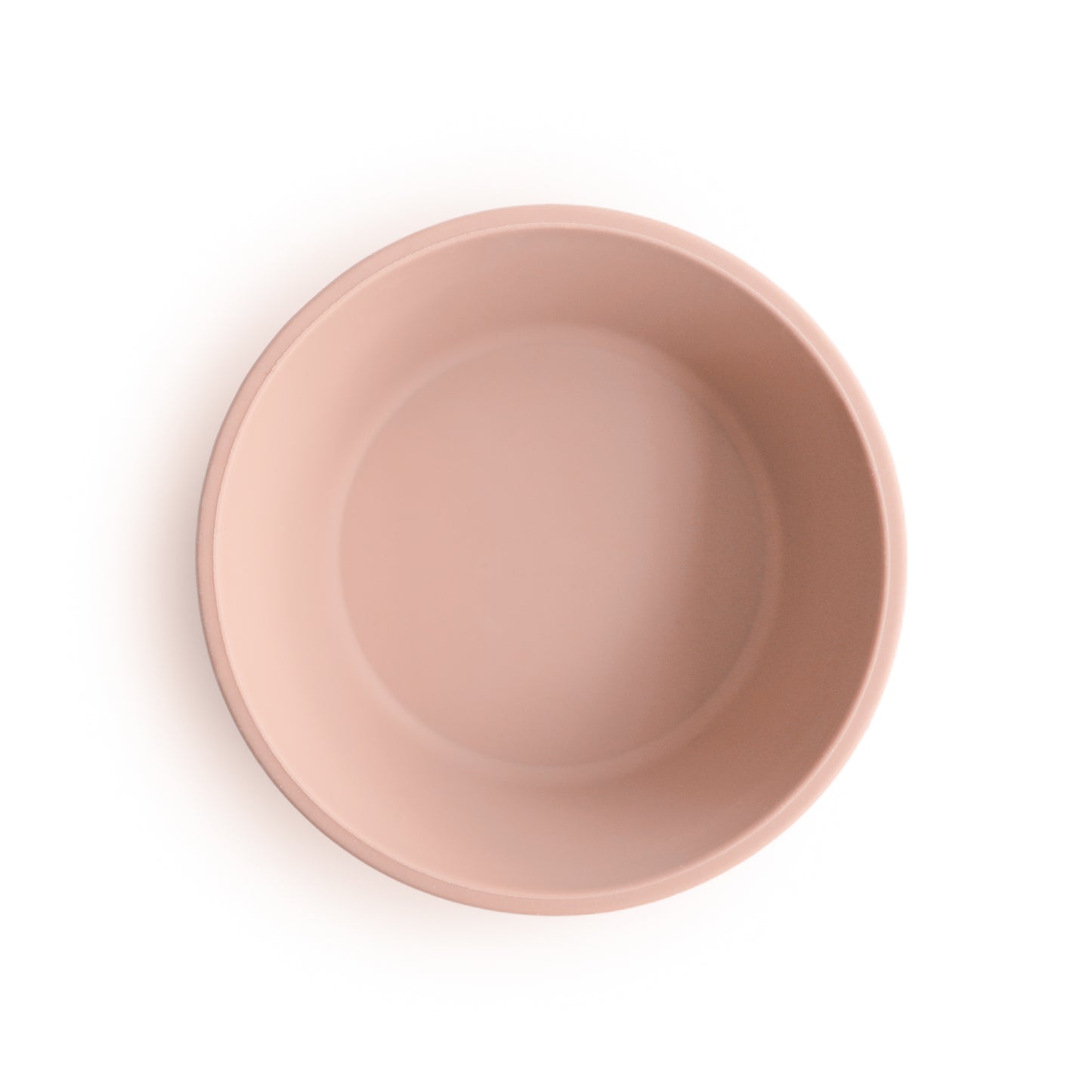 Pink silicone suction bowl top view on a white background