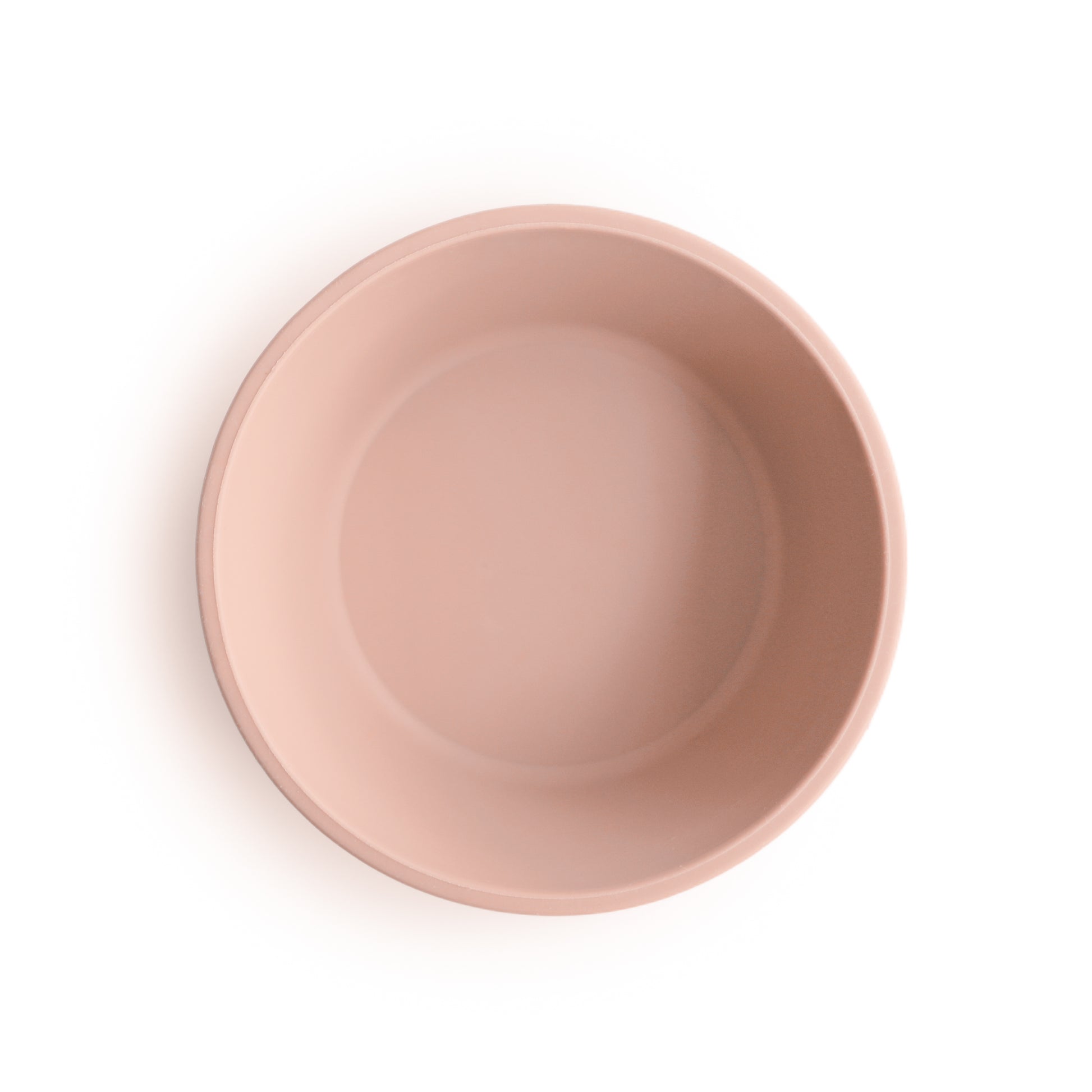 Pink silicone suction bowl top view on a white background