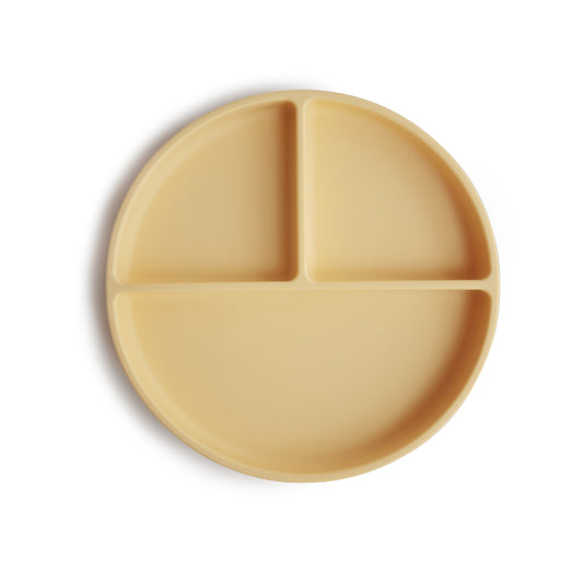 Yellow silicone plate with three sections on a white background