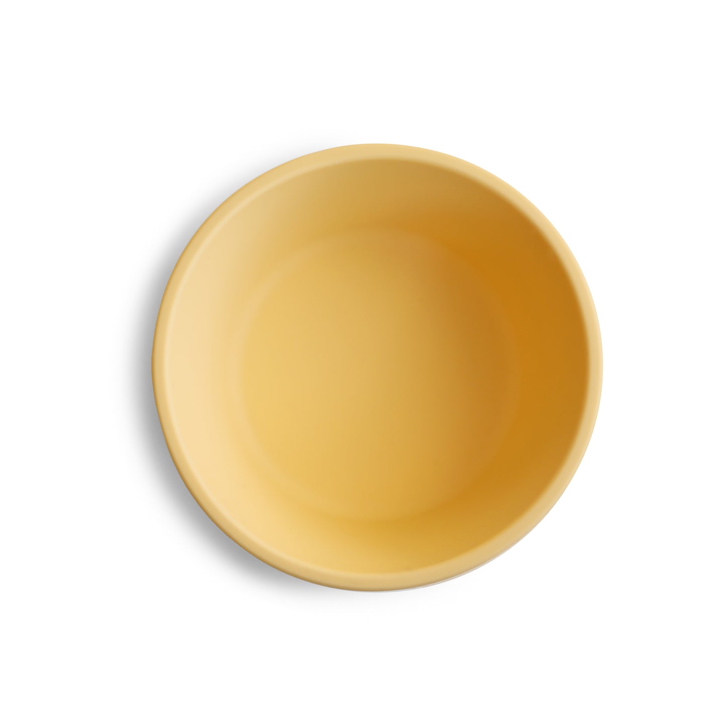 Yellow silicone suction bowl top view on a white background