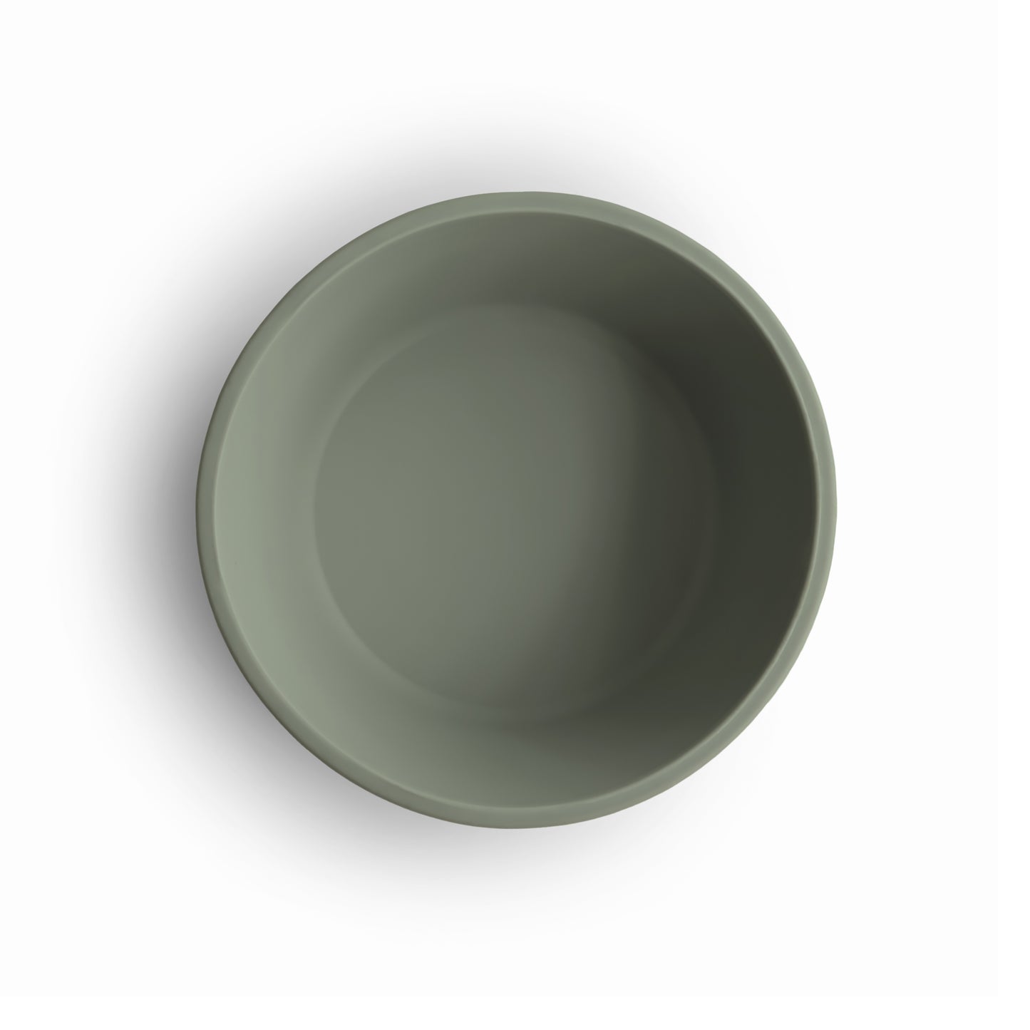 Green silicone suction bowl top view on a white background