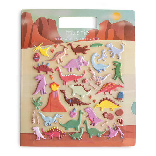 Packaging of Mushie dinosaur stickers with colorful illustrations on a desert landscape.