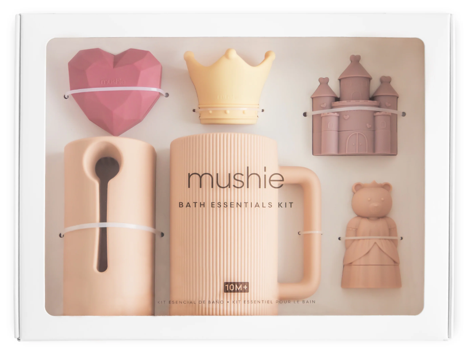 Mushie princess bath essentials kit with various shaped toys in a box, including a crown, castle and bear princess