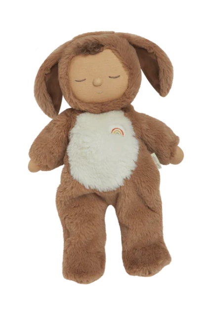 Plush toy in a brown animal costume with a rainbow on a white background